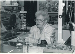 Volunteer working at the Corner Store